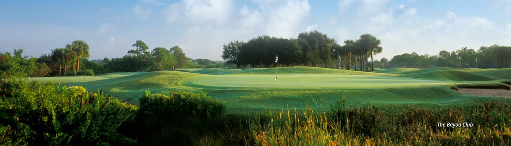 flagpole on golf course green at The Bayou Club